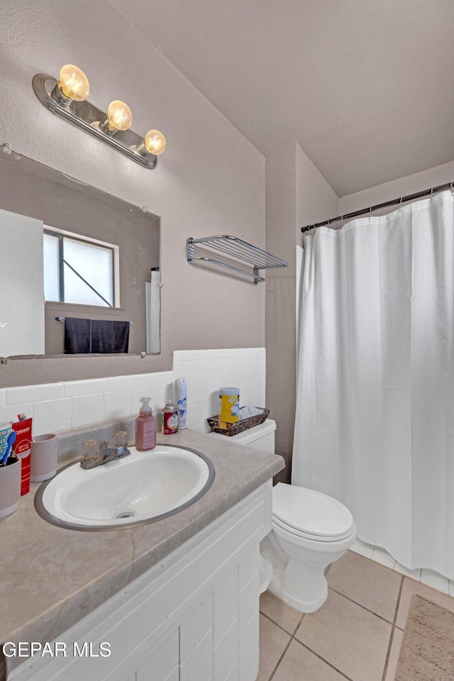 full bath with vanity, curtained shower, tile patterned flooring, toilet, and decorative backsplash