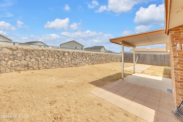 view of yard featuring a patio area and a fenced backyard
