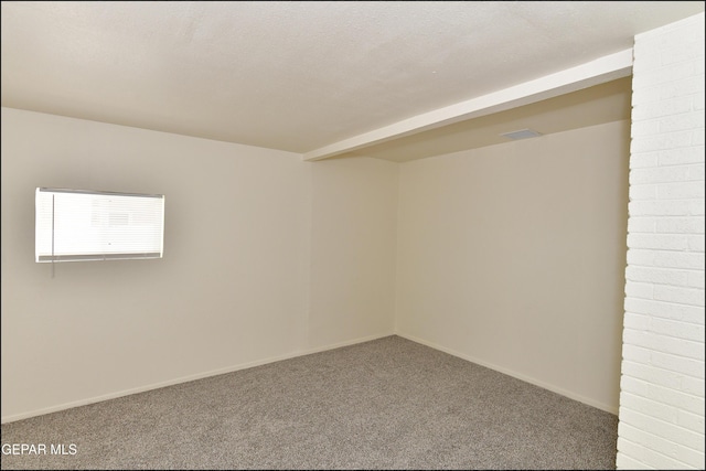 spare room with baseboards and carpet flooring