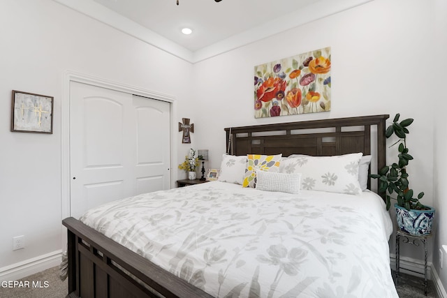 bedroom featuring a closet and baseboards
