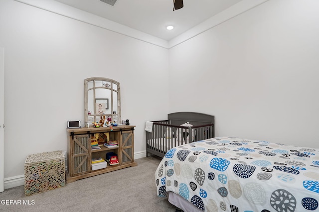 bedroom featuring baseboards, a ceiling fan, and carpet
