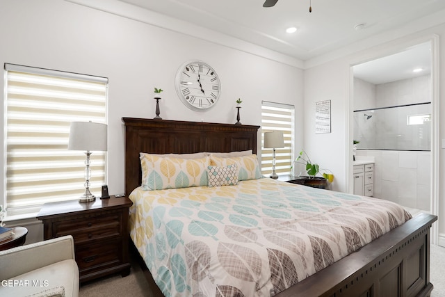 bedroom with ornamental molding, recessed lighting, carpet flooring, and ensuite bath