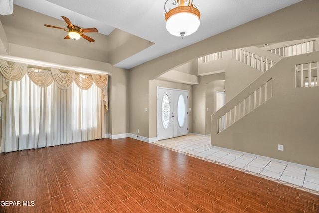 2987 Tierra Limon Dr, El Paso, TX 79938 - entryway featuring ceiling fan, stairs, wood finished floors, arched walkways, and baseboards