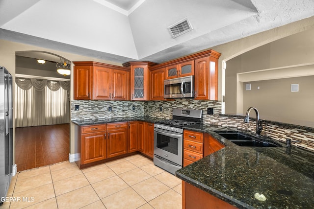 2987 Tierra Limon Dr, El Paso, TX 79938 - kitchen with appliances with stainless steel finishes, a sink, decorative backsplash, and light tile patterned flooring
