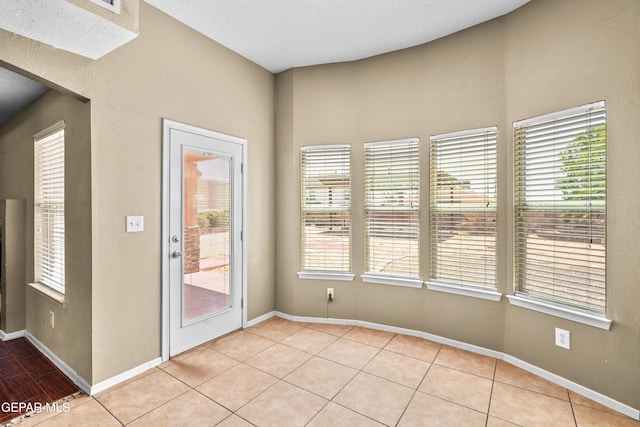 2987 Tierra Limon Dr, El Paso, TX 79938 - unfurnished dining area with light tile patterned floors and baseboards
