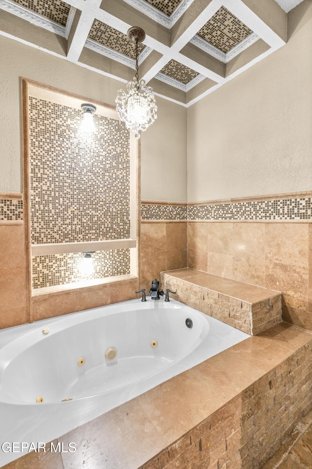 2987 Tierra Limon Dr, El Paso, TX 79938 - bathroom featuring coffered ceiling, beamed ceiling, a jetted tub, tile walls, and crown molding