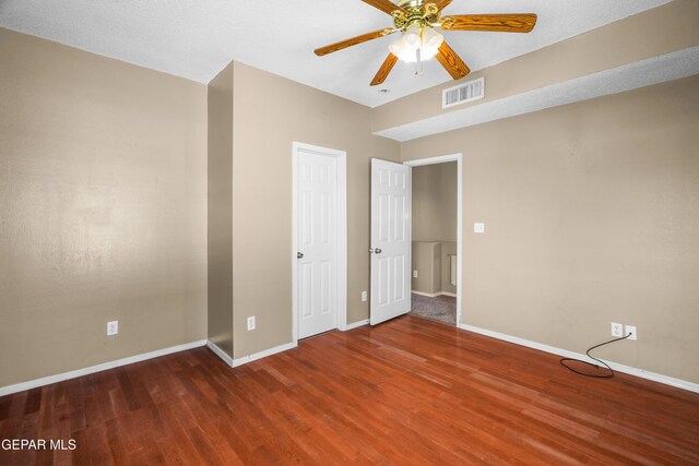 2987 Tierra Limon Dr, El Paso, TX 79938 - unfurnished bedroom featuring wood finished floors, baseboards, and ceiling fan