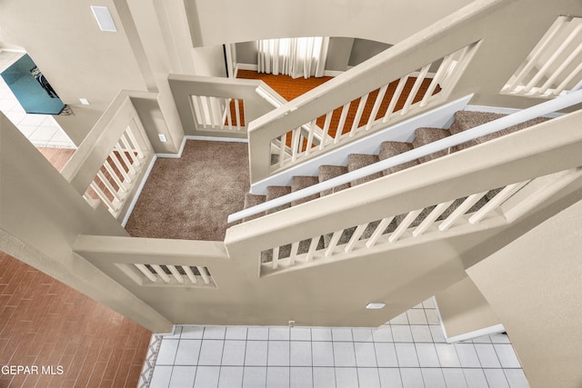 2987 Tierra Limon Dr, El Paso, TX 79938 - stairway with baseboards and tile patterned floors