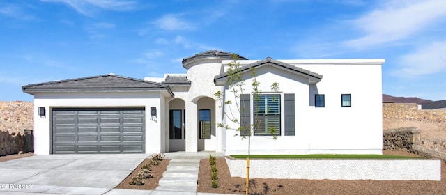 1846 Pommel Pl, El Paso, TX 79911 - view of front facade featuring concrete driveway, stucco siding, a tiled roof, and a garage