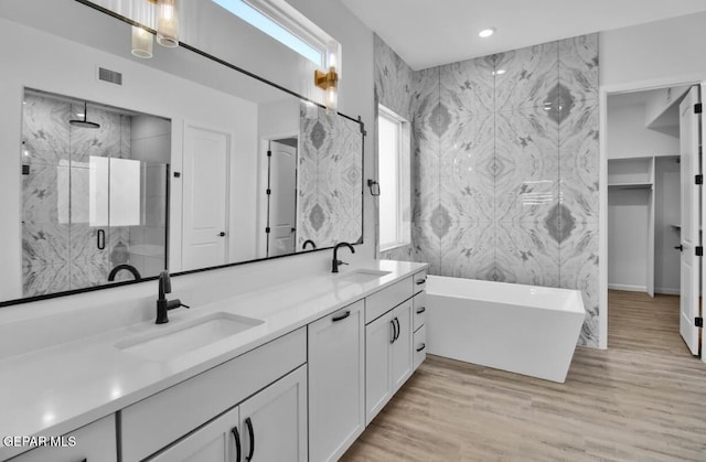 1846 Pommel Pl, El Paso, TX 79911 - full bath with double vanity, a shower stall, a soaking tub, and a sink