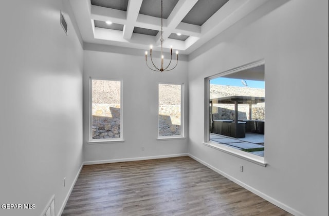 1846 Pommel Pl, El Paso, TX 79911 - unfurnished dining area with baseboards, beam ceiling, a notable chandelier, and coffered ceiling