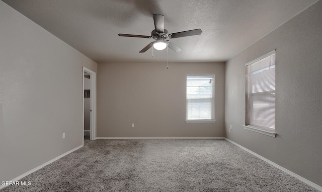 10677 Canyon Sage Dr, El Paso, TX 79924 - carpeted spare room with a ceiling fan, a textured ceiling, and baseboards