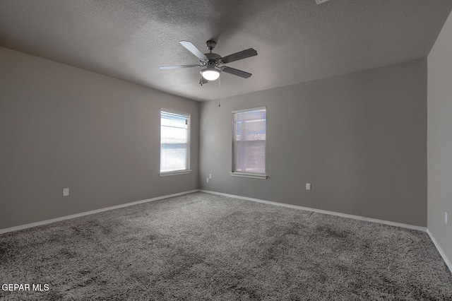 10677 Canyon Sage Dr, El Paso, TX 79924 - empty room featuring carpet, ceiling fan, a textured ceiling, and baseboards