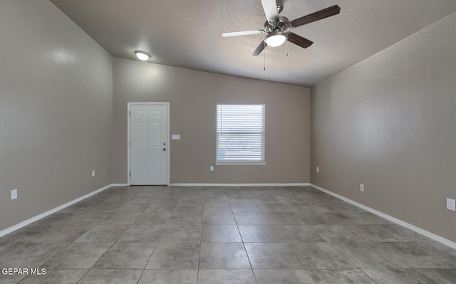 10677 Canyon Sage Dr, El Paso, TX 79924 - spare room with lofted ceiling, ceiling fan, a textured ceiling, baseboards, and tile patterned floors
