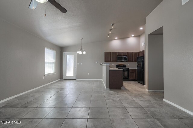 10677 Canyon Sage Dr, El Paso, TX 79924 - kitchen featuring black appliances, ceiling fan, open floor plan, light countertops, and a chandelier