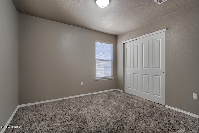 10677 Canyon Sage Dr, El Paso, TX 79924 - unfurnished bedroom featuring carpet, a closet, and baseboards