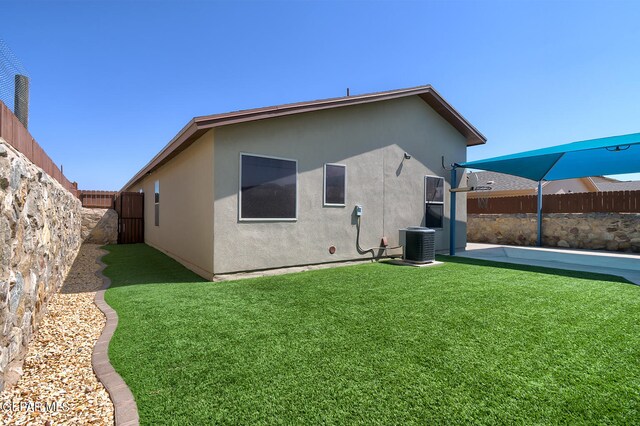 10677 Canyon Sage Dr, El Paso, TX 79924 - back of property featuring central air condition unit and stucco siding