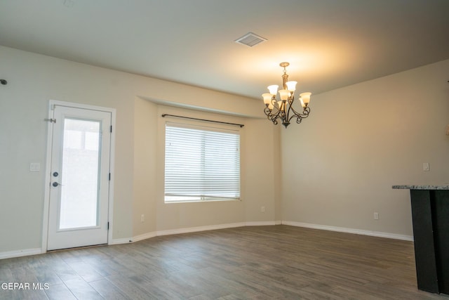 756 Jalynn Grace, Canutillo, TX 79835 - unfurnished dining area featuring a chandelier, wood finished floors, and plenty of natural light