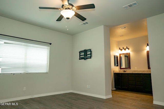 756 Jalynn Grace, Canutillo, TX 79835 - unfurnished bedroom featuring wood finished floors, ensuite bathroom, and bar
