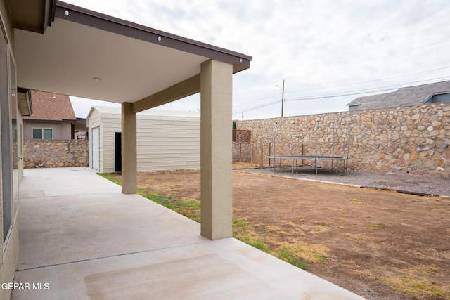 756 Jalynn Grace, Canutillo, TX 79835 - fenced backyard featuring a patio and a trampoline