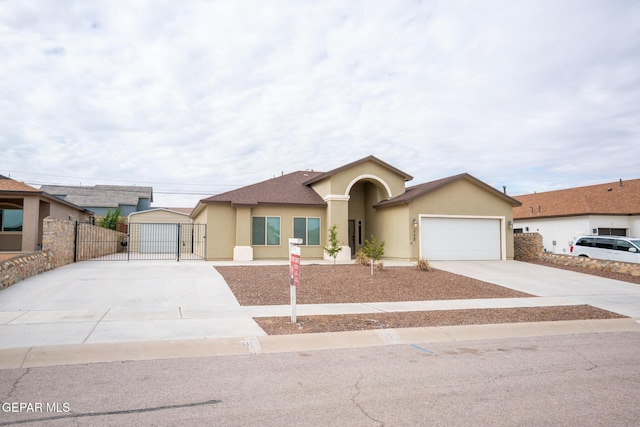 756 Jalynn Grace, Canutillo, TX 79835 - view of front of home featuring driveway, a gate, stucco siding, and an attached garage