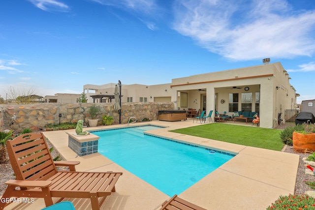 view of swimming pool with a fenced backyard, outdoor lounge area, a ceiling fan, a patio area, and a hot tub