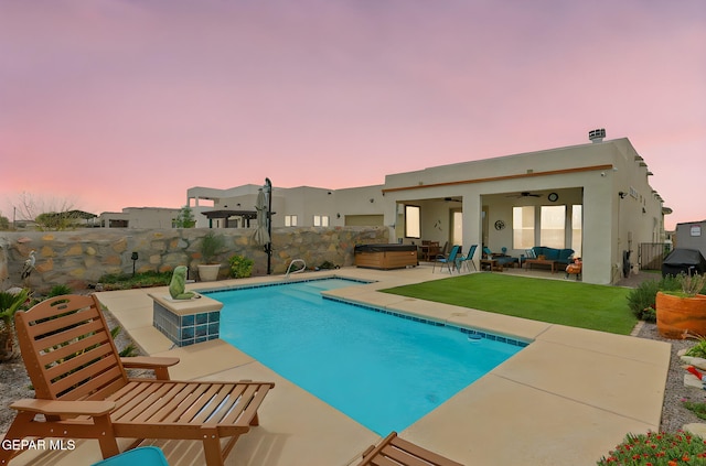 view of swimming pool featuring a fenced backyard, outdoor lounge area, a patio, and ceiling fan