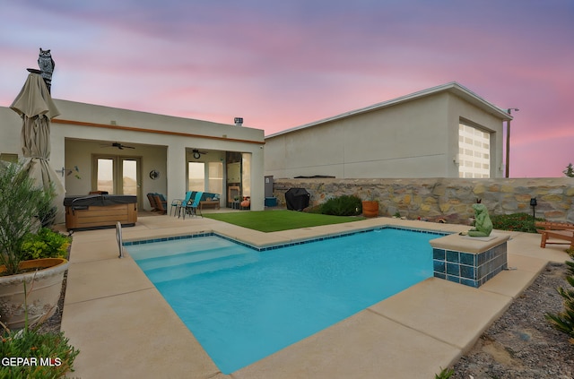 view of swimming pool with a fenced in pool, a ceiling fan, a hot tub, and a patio
