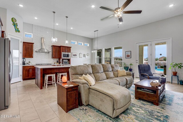 living area with ceiling fan, light tile patterned floors, and recessed lighting