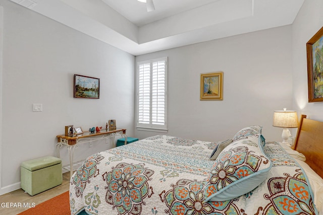 bedroom with baseboards and ceiling fan