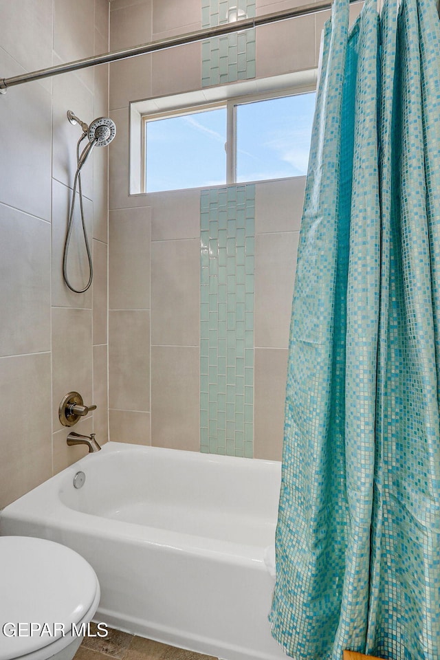 full bath featuring toilet and shower / bath combo