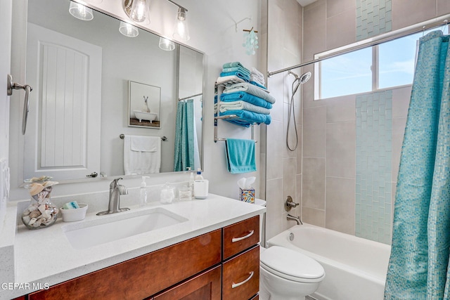 bathroom with toilet, vanity, and shower / bathtub combination with curtain