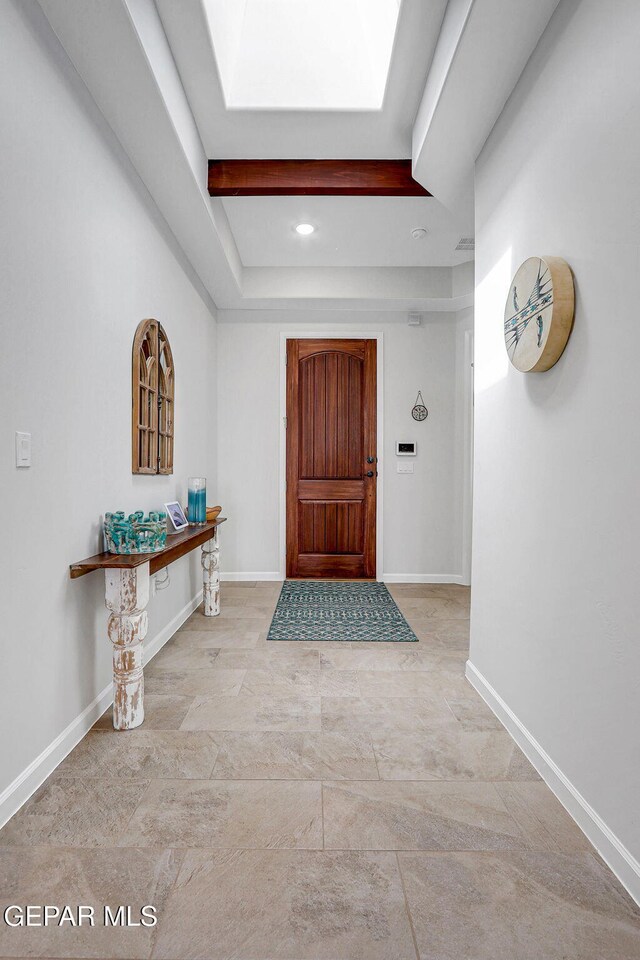 entryway with recessed lighting and baseboards