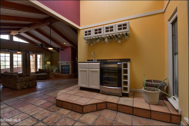 29 Cielo Vis, Anthony, NM 88021 - bar with beamed ceiling, ceiling fan, a sink, beverage cooler, and indoor wet bar
