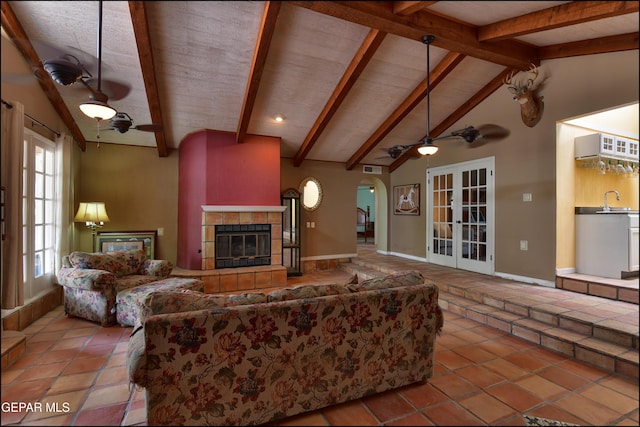 29 Cielo Vis, Anthony, NM 88021 - tiled living area with vaulted ceiling with beams, french doors, a sink, and a ceiling fan