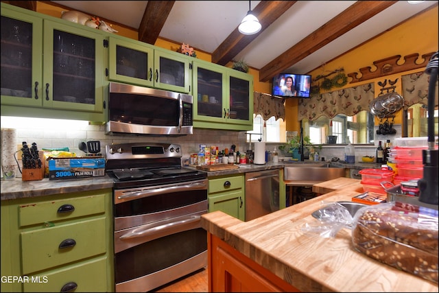 29 Cielo Vis, Anthony, NM 88021 - kitchen featuring a sink, appliances with stainless steel finishes, beamed ceiling, wood counters, and decorative backsplash