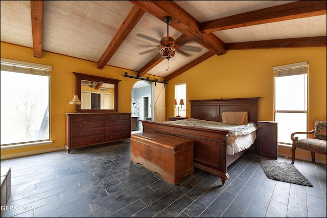 29 Cielo Vis, Anthony, NM 88021 - bedroom with lofted ceiling with beams, a barn door, arched walkways, ceiling fan, and dark wood-style flooring