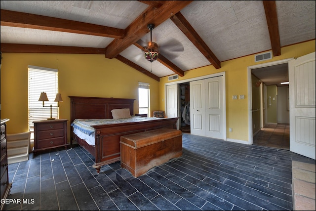 29 Cielo Vis, Anthony, NM 88021 - unfurnished bedroom featuring wood tiled floor, vaulted ceiling with beams, a closet, and visible vents