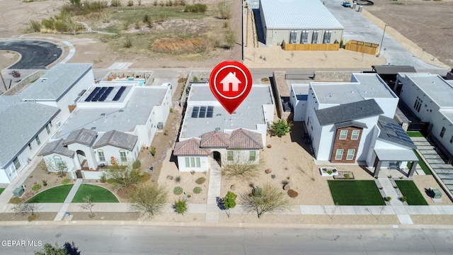 birds eye view of property with a residential view