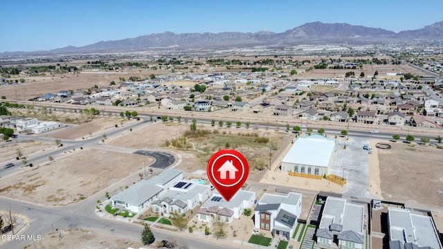 birds eye view of property with a residential view and a mountain view