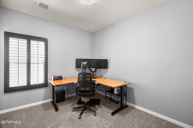office featuring baseboards, visible vents, and carpet floors