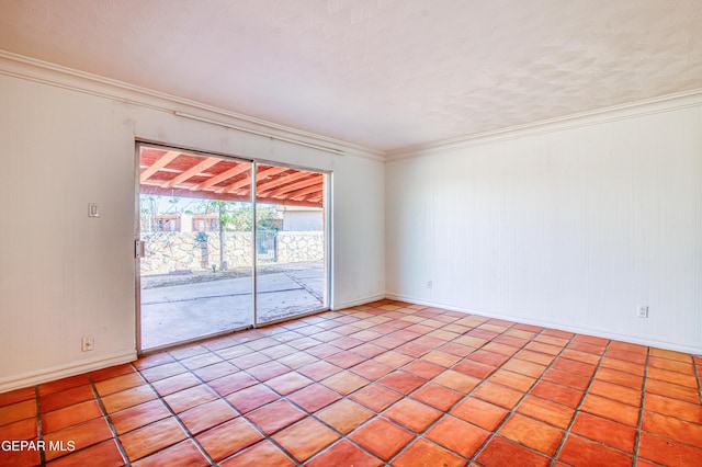 unfurnished room featuring ornamental molding, baseboards, and light tile patterned floors