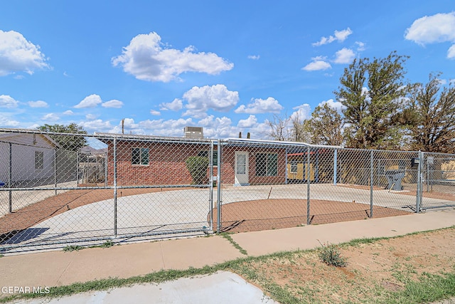 view of home's community with a gate and fence