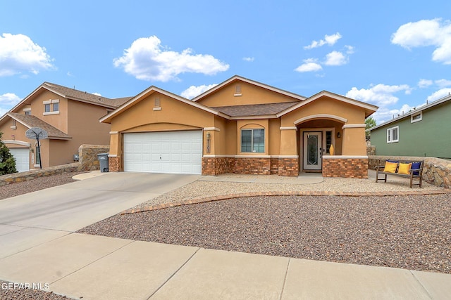 7101 Luz De Sol Dr, El Paso, TX 79912 - ranch-style home with a shingled roof, stone siding, a garage, concrete driveway, and stucco siding