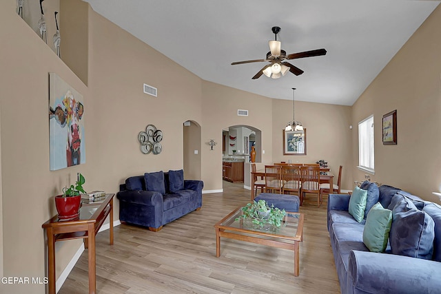 7101 Luz De Sol Dr, El Paso, TX 79912 - living area featuring ceiling fan, arched walkways, light wood-type flooring, visible vents, and baseboards