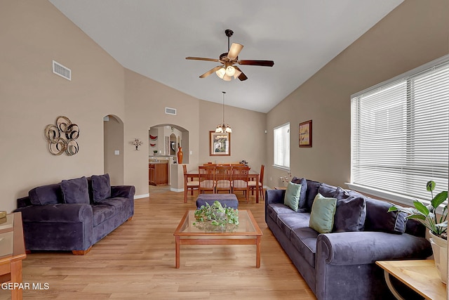 7101 Luz De Sol Dr, El Paso, TX 79912 - living area with baseboards, visible vents, ceiling fan, arched walkways, and light wood finished floors