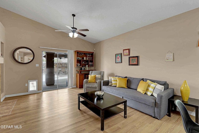7101 Luz De Sol Dr, El Paso, TX 79912 - living area featuring baseboards, ceiling fan, a textured ceiling, light wood finished floors, and lofted ceiling