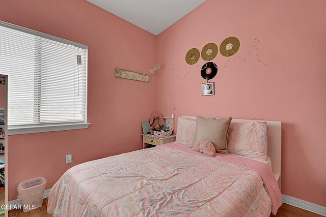 7101 Luz De Sol Dr, El Paso, TX 79912 - bedroom with baseboards and wood finished floors
