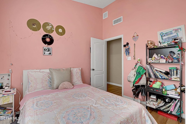 7101 Luz De Sol Dr, El Paso, TX 79912 - bedroom featuring visible vents, baseboards, and wood finished floors