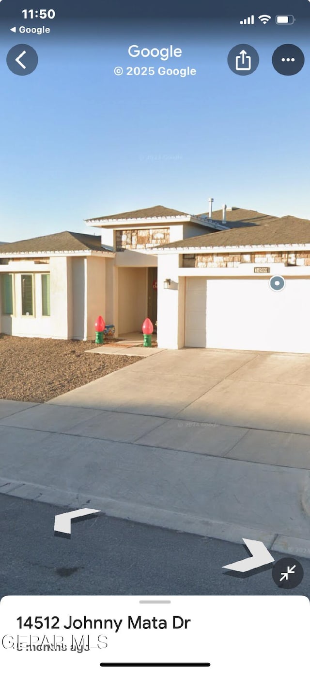 14509 Johnny Mata Dr, El Paso, TX 79938 - view of front of home with a garage and stucco siding